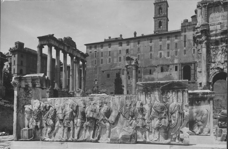 015847 - monumento - Foro Romano, Plutei di Traiano, il rilievo con il condono dei debiti con, in secondo piano, il Tempio di Saturno; senza negativo