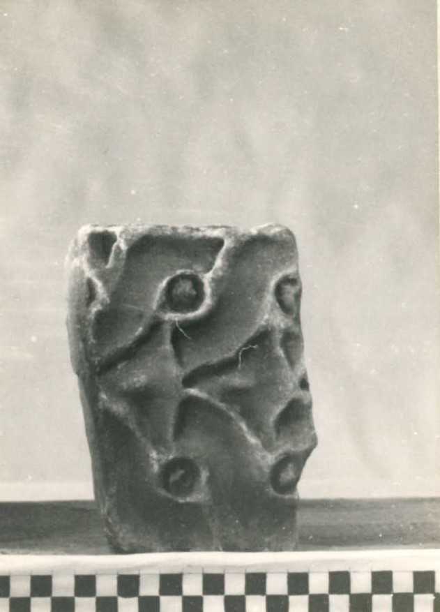 Frammento di elemento decorativo.